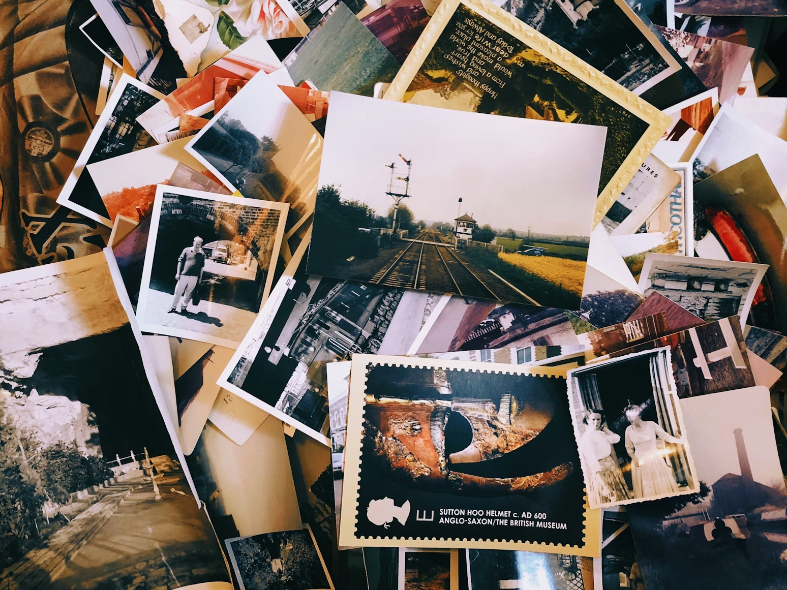 A collection of printed family photographs ready to be scanned